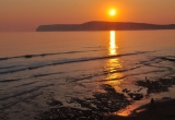 Sunset over Compton Bay by Paul Bradley