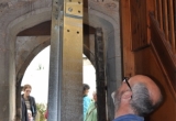 A new beam for the bells to hang from is eased into the bell tower.