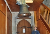 Slowly a new bell is winched up into the bell tower watched by Becky Noyes.