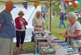 Brighstone Library stall with plenty of books for sale.