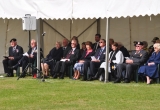 AN ATTENTIVE AUDIENCE OF DIGNITARIES ARE IN ATTENDANCE